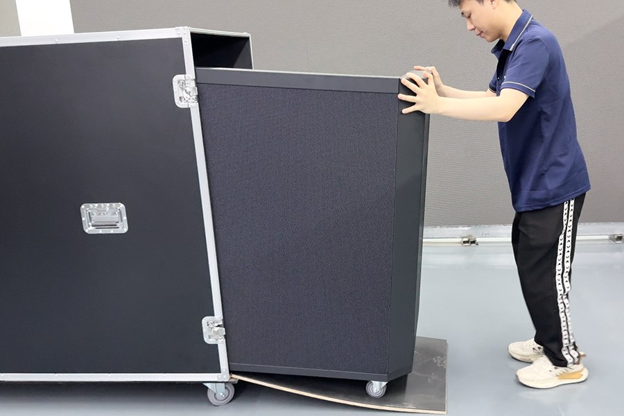 Unpacking-a-mobile-DJ-booth-from-its-flight-case.